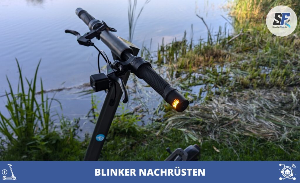 In der Nähe eines Gewässers ist ein E-Scooter-Lenker mit beleuchtetem Blinker zu sehen, der veranschaulicht, wie einfach sich dieser für mehr Sicherheit nachrüsten lässt.